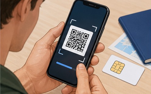 Traveler activating a prepaid eSIM by scanning a QR code